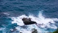 Splits Waves Against Rocks In Sea