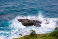 Splits Waves Against Rocks In Sea