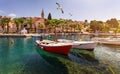 Splitska village with beautiful port and seagull's flying over the village, Brac island, Croatia. Fishing boats in Splitska