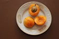 Splitted apricots on the saucer