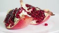 Splitted pomegranate fruit on plate rotates