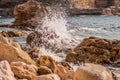 Splitting waves against picturesque rocks in the sea