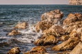 Splitting waves against picturesque rocks in the sea