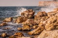 Splitting waves against picturesque rocks in the sea