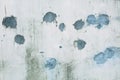 Splodgy grey wall background with blue spots Royalty Free Stock Photo