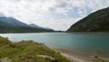 Spluegenpass with the Monte Spluga reservoir and surrounding mountains in summer