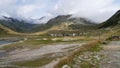 Spluegenpass with the Monte Spluga reservoir and surrounding mountains in summer Royalty Free Stock Photo