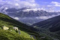 SPLÃÅGEN, SWITZERLAND - AUGUST 19, 2021: SplÃÂ¼gen pass road with mountain house SplÃÂ¼gen Royalty Free Stock Photo