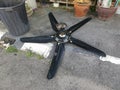 Spoiled black ceiling fan thrown on the street