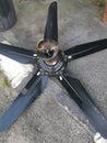 Spoiled black ceiling fan thrown on the street