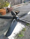 Spoiled black ceiling fan thrown on the street