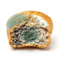 Spoiled bread roll with mold and discoloration on solid white background Royalty Free Stock Photo