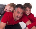 Spoiled children on their fathers back Royalty Free Stock Photo