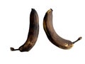 Spoiled, darkened bananas, on a white background. Old stale fruits on a light table. Perishable natural products