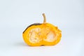 Spoiled orange pumpkin in a cut on a white background Royalty Free Stock Photo