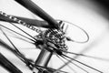 Spoked bicycle wheel and cassette gears in motion Royalty Free Stock Photo