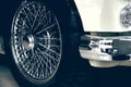 Spoked wheel of a white luxury car. Antique automovile and empty copy space Royalty Free Stock Photo