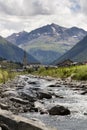 Spol river with church of Santa Maria in Livigno Italy