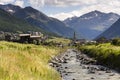 Spol river with church of Santa Maria in Livigno Italy