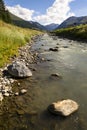 Spol river with church of Santa Maria in Livigno Italy