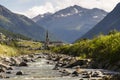 Spol river with church of Santa Maria in Livigno Italy