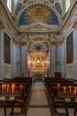 View of a side chapel and altar in the Spoleto Cathedral with votive candles in the foreground