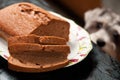 Sponge cake and hungry dog Royalty Free Stock Photo