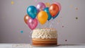 sponge cake with large layer of cream on a stand, with many balloons above it