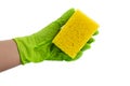 Sponge for dishes in a female hand in a green glove isolated on a white background. Copy space Royalty Free Stock Photo