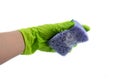 Sponge for dishes in a female hand in a green glove isolated on a white background. Copy space Royalty Free Stock Photo