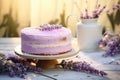 Sponge lavender cream cake with berry cream adorned with a fresh lavender branch on sunny light background. Generative