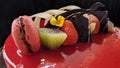 Sponge pieces on a table neatly arranged, served to visitorsStrawberry mousse cake served with topping strawberries, kiwi fruit an Royalty Free Stock Photo