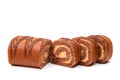 Sponge roll with chocolate cream, on a white background Royalty Free Stock Photo