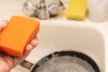 Sponge for washing dishes in a people hand Royalty Free Stock Photo