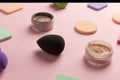 Sponges, beauty blender for applying foundation or powder. Flat lay on a pink background, copy space Royalty Free Stock Photo