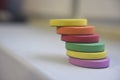 Spongy flat items of different colours on the white background indoor