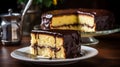 Spongy layers embrace velvety custard, enrobed in a glossy chocolate coat. A symphony of textures