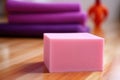 spongy yoga block on exercise mat