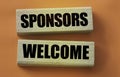 SPONSORS WELCOME on wooden blocks. Sponsorship donation business concept. Royalty Free Stock Photo