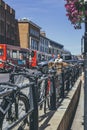 Spontaneous bicycle parking alongside railings on a street in London