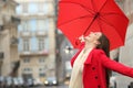 Spontaneous woman celebrating under the rain in winter