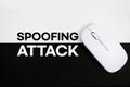 Spoofing Attack text and wireless mouse on white and black background Royalty Free Stock Photo