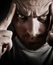 Spooky angry man with evil sinister eyes Royalty Free Stock Photo