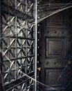 Spooky Crypt Door Covered in Spiderwebs Royalty Free Stock Photo