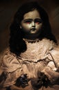 Spooky doll with red bright eyes Royalty Free Stock Photo