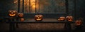 A spooky forest sunset with a haunted evil glowing eyes of Jack O\' Lanterns on the left of a wooden bench on a scary halloween ni