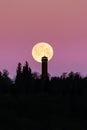 Spooky full moon over a tower in silhouette Royalty Free Stock Photo