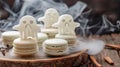 Spooky Ghost-Shaped Meringues on Halloween Themed Macarons with Smoke