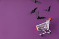 Spooky Halloween composition made of shopping basket and halloween decorations