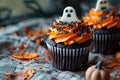 Spooky Halloween Cupcakes with Ghost Toppings. Royalty Free Stock Photo